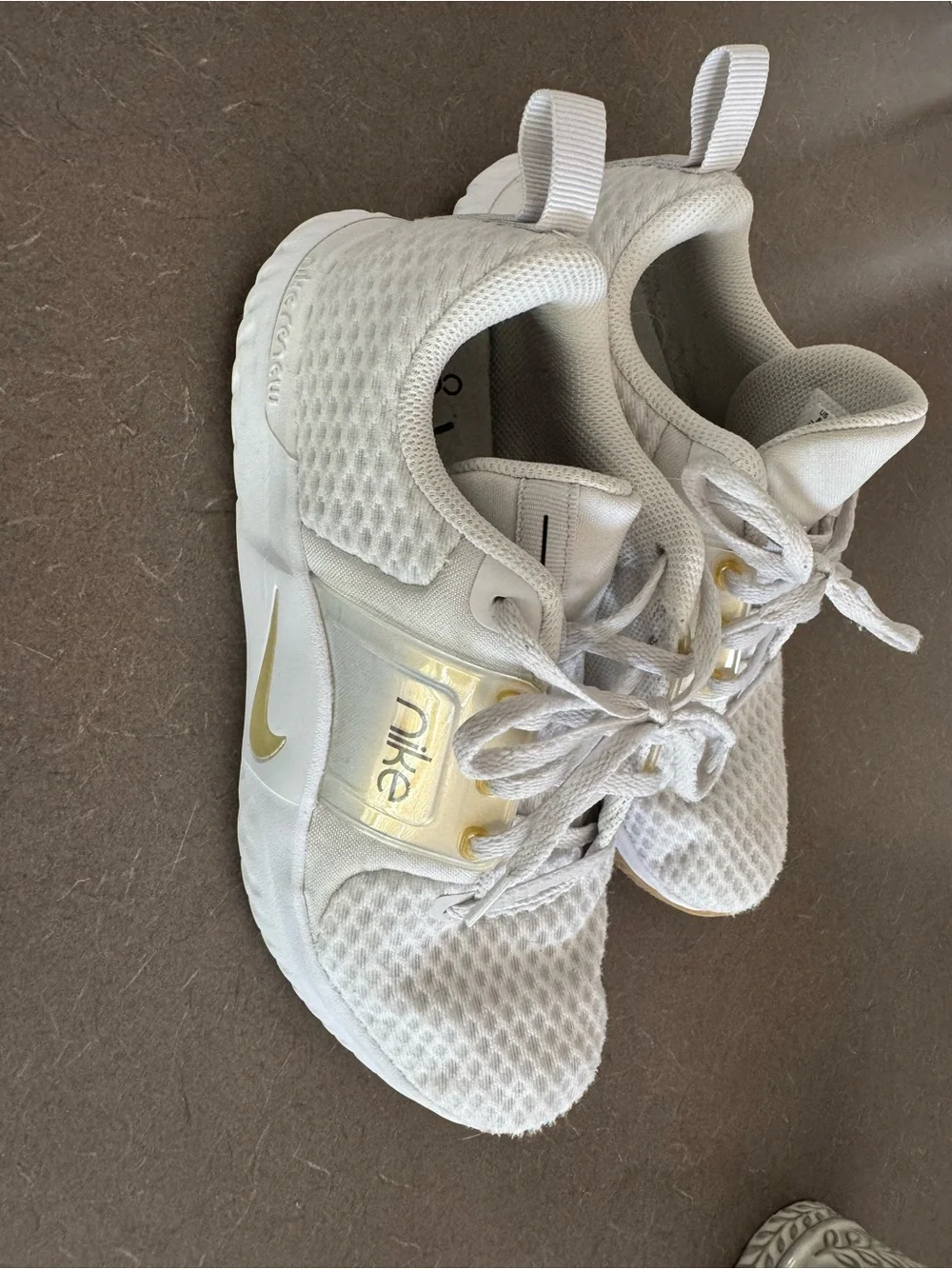 Nike White Sneakers with Gold Accents
